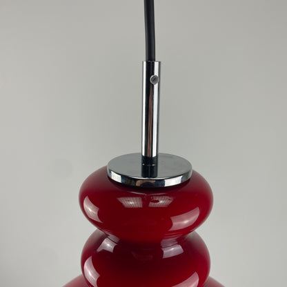 Red glass pendant light by Peill and Putzler, 1960