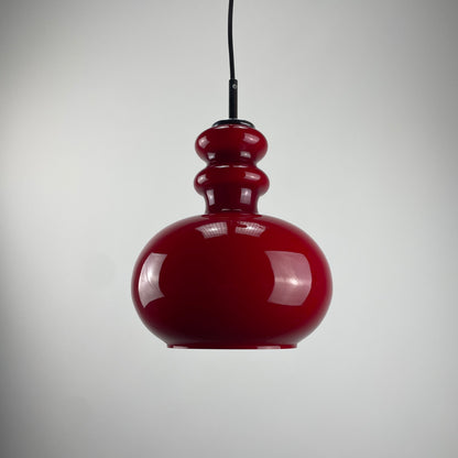 Red glass pendant light by Peill and Putzler, 1960