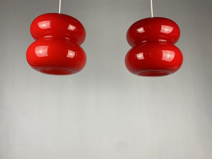 Set of two red pendant lights by Herwig and Frank Sterckx Glasfabriek De Rupel 1970