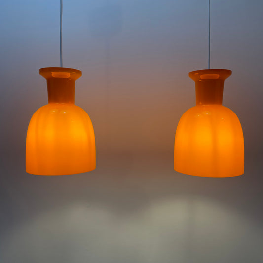 pair of orange glass B-1203 pendant lights
Raak Amsterdam 1960s lighting
mid-century modern Dutch design
vintage orange glass pendant lights
Raak pendant lights for sale